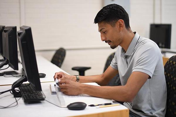 Student studying in front of computer